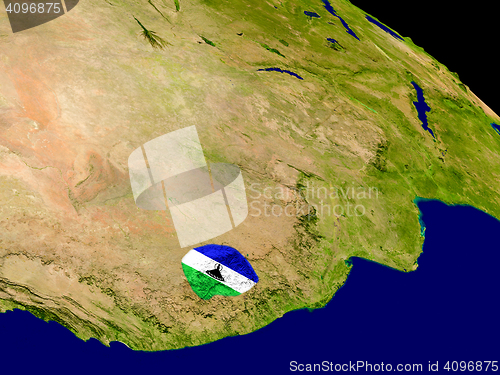 Image of Lesotho with flag on Earth