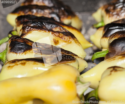 Image of yellow pepper on fire