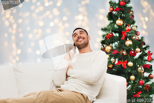 Image of man calling on smartphone for christmas