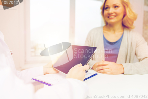 Image of doctor with tablet pc and woman at hospital