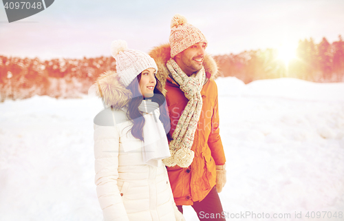 Image of happy couple walking over winter background