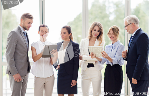 Image of business people with tablet pc computers at office