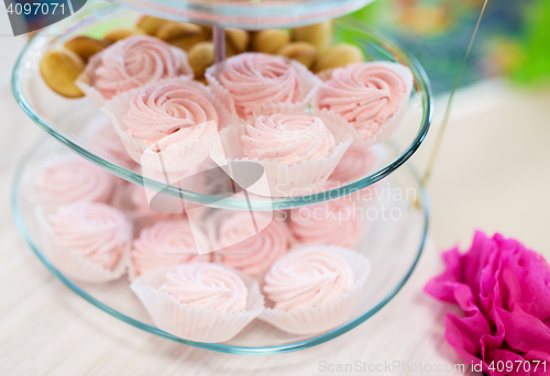 Image of close up of custard sweets on glass serving tray