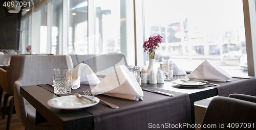 Image of restaurant interior with tables and chairs