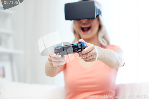 Image of woman in virtual reality headset with controller