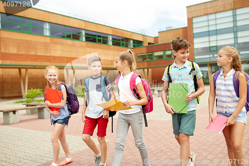 Image of group of happy elementary school students walking