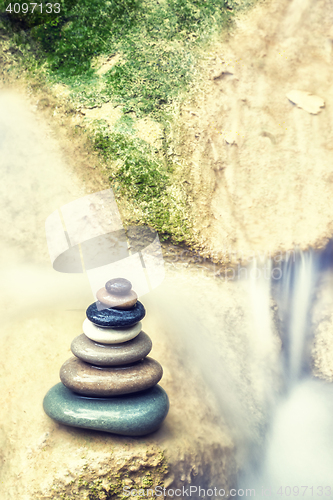 Image of Rock Zen Stack in front of waterfall.