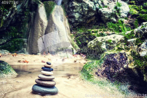 Image of Rock Zen Stack in front of waterfall.