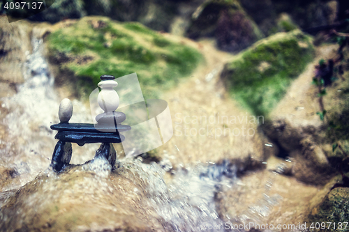 Image of Rock Zen Stack in front of waterfall.