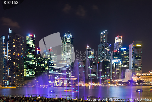 Image of  Marina Bay Sands at night during Light and Water Show \'Wonder F