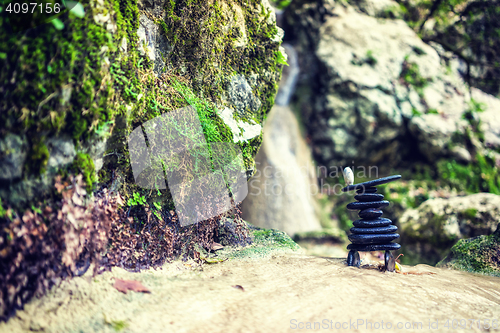 Image of Rock Zen Stack in front of waterfall.