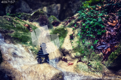 Image of Rock Zen Stack in front of waterfall.