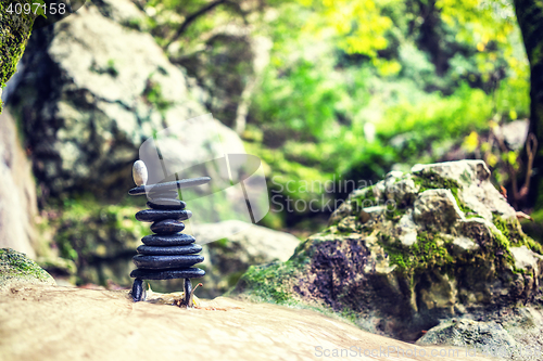 Image of Rock Zen Stack in front of waterfall.