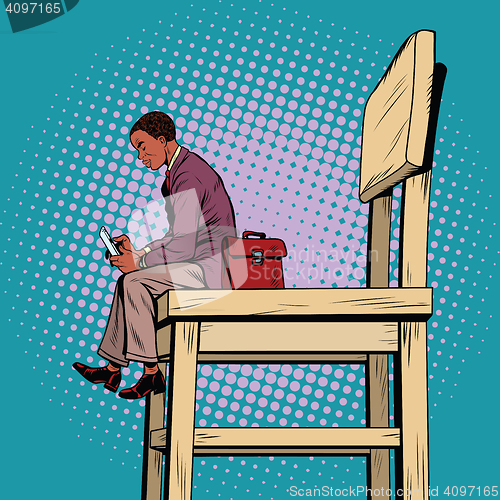 Image of Small business man on the big chair, and smartphone