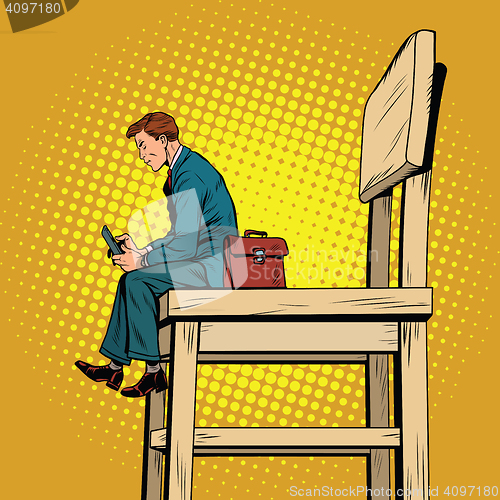 Image of Small business man on the big chair, and smartphone