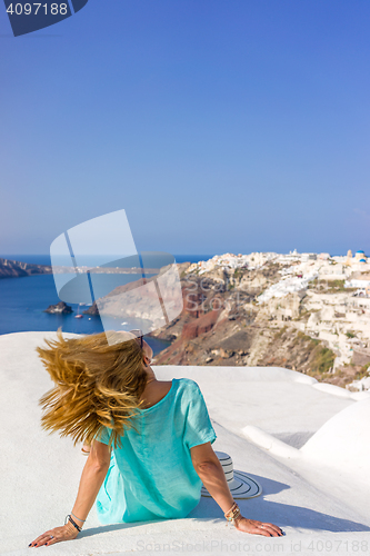 Image of Young woman on holidays, Santorini Oia town 