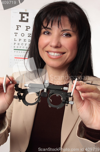 Image of Optometrist holding trial frames