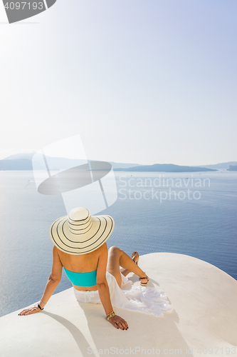 Image of Young woman on holidays, Santorini Oia town