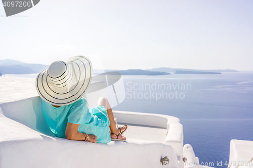 Image of Young woman on holidays, Santorini Oia town 