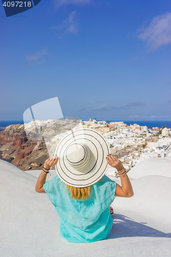 Image of Young woman on holidays, Santorini Oia town 