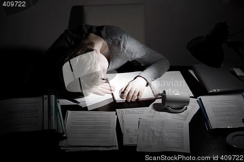 Image of asleep working overhours