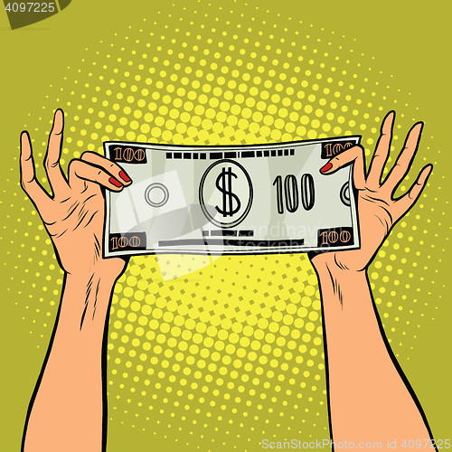 Image of Female hands holding a hundred dollar bill