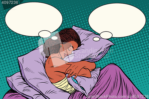 Image of Young woman in bed hugging a pillow