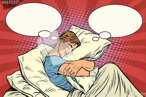 Image of Dreamer man in bed hugging a pillow