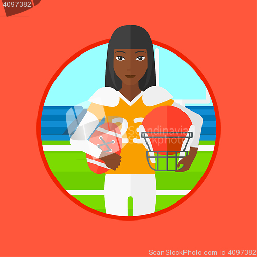 Image of Rugby player with ball and helmet in hands.