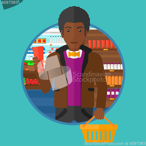 Image of Customer with shopping basket and tube of cream.