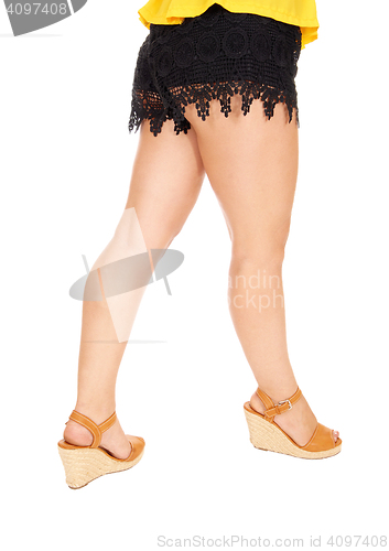 Image of Lovely legs in black shorts.