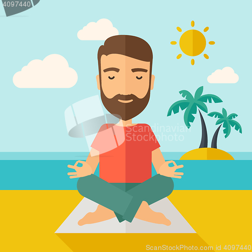 Image of Man doing yoga in the beach
