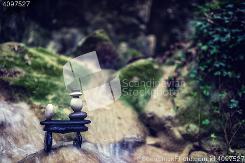 Image of Rock Zen Stack in front of waterfall.