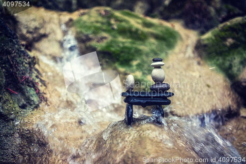 Image of Rock Zen Stack in front of waterfall.