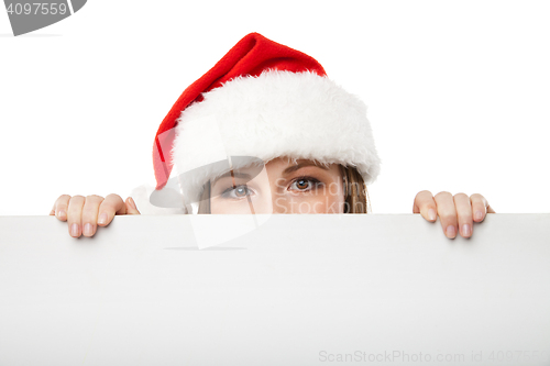 Image of Christmas woman in santa hat holding empty board