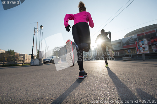 Image of young  couple jogging