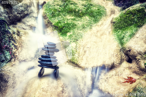 Image of Rock Zen Stack in front of waterfall.