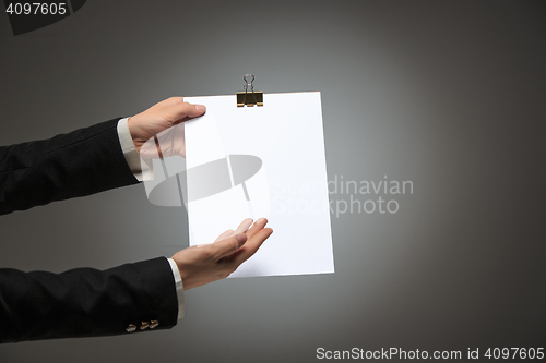 Image of Male hands holding empty blank