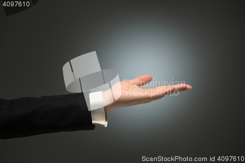 Image of Dressed in a business suit caucasian male hand