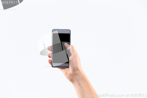 Image of Human hand holding blank large mobile smart phone