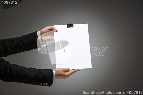 Image of Male hands holding empty blank