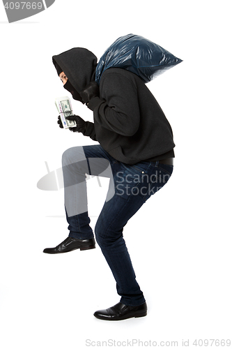 Image of Thief with bag on shoulders