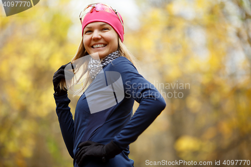 Image of Happy woman in sports wear