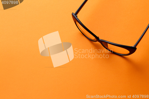 Image of Glasses on blank orange background