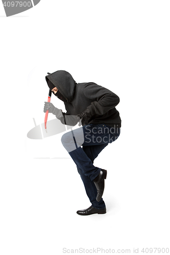 Image of Burglar in mask with passkey