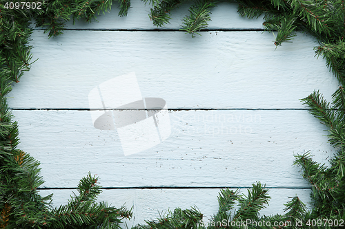 Image of Christmas, new year wooden board with fir branches square frame