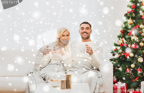 Image of happy couple at home with christmas tree