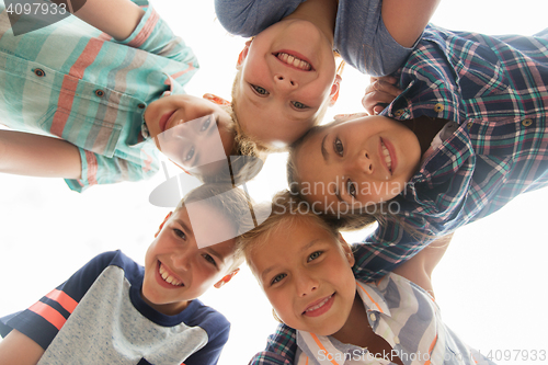 Image of group of happy children faces in circle