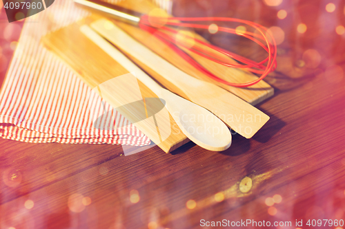 Image of close up of cooking kitchenware on wooden board