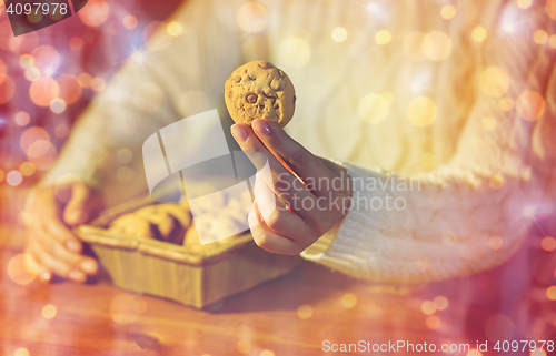 Image of close up of woman with christmas  oat cookies